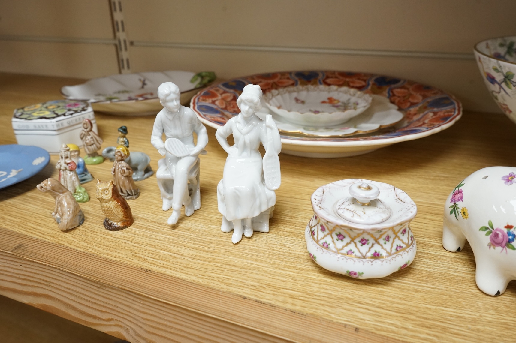 A collection of porcelain and pottery to include commemorative china, a leaf dish and group of wade figures, largest 29cm in diameter